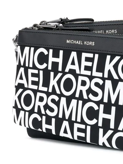 Shop Michael Michael Kors Logo Clutch Bag In Black