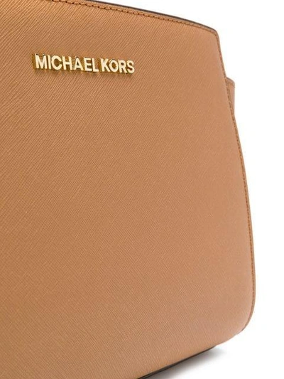 Shop Michael Michael Kors Logo Cross Body Bag - Brown