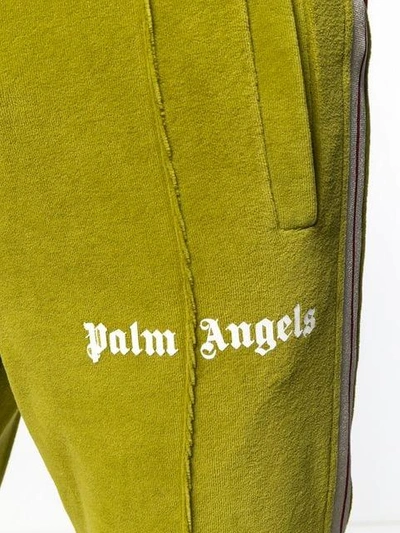 Shop Palm Angels Side Stripe Trousers