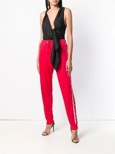 Shop Versace Logo Track Pants - Red