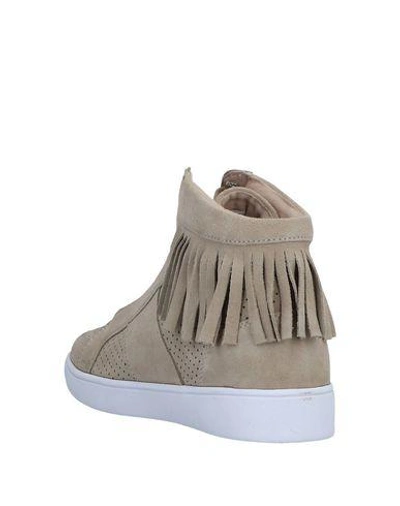 Shop Guess Sneakers In Sand