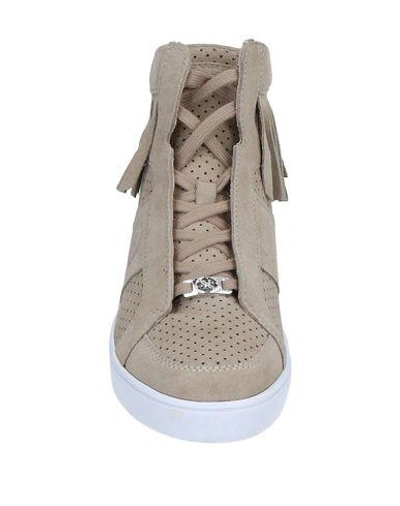 Shop Guess Sneakers In Sand