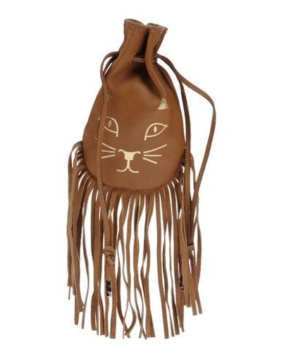 Shop Charlotte Olympia Handbag In Camel