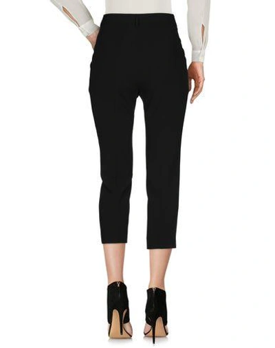 Shop Moschino Cropped Pants & Culottes In Black