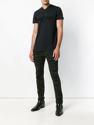 Shop Balmain Army Print Skinny Trousers - Black