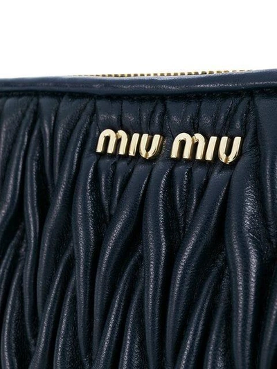 Shop Miu Miu Quilted Logo Plaque Clutch - Blue