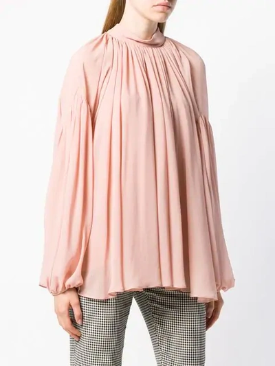 long-sleeve flared blouse