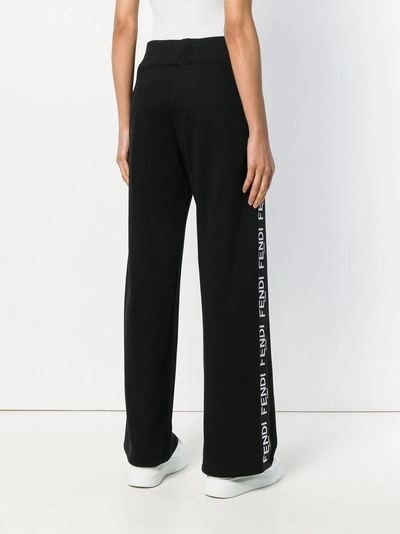 Shop Fendi Side Tape Flared Trousers In F0gme