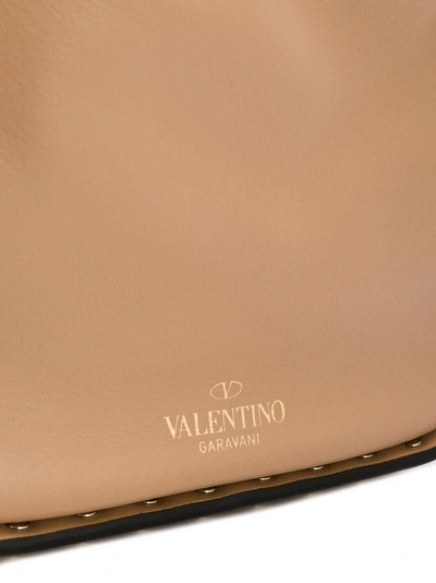 Shop Valentino Garavani Rockstud Bucket Shoulder Bag - Neutrals