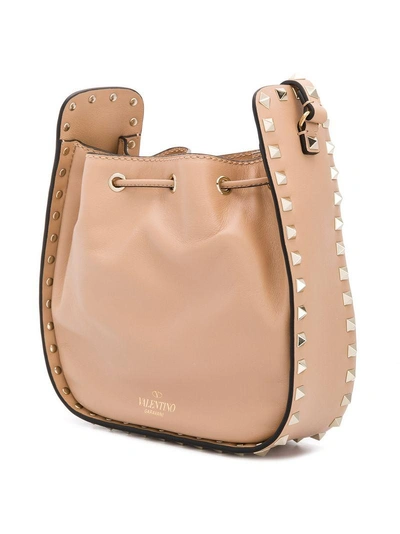 Shop Valentino Garavani Rockstud Bucket Shoulder Bag - Neutrals