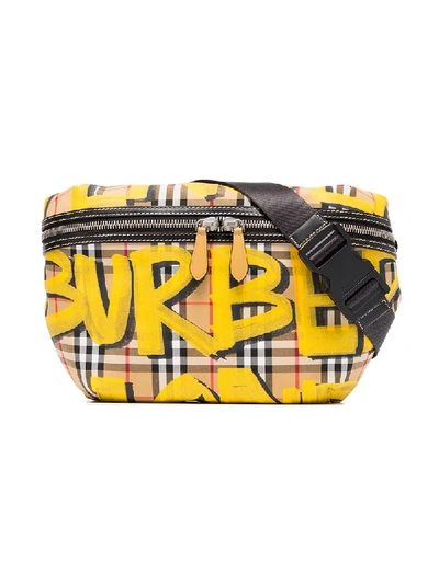 Shop Burberry Yellow, Black And Brown Large Graffiti Print Vintage Check And Leather Bum Bag In Yellow & Orange