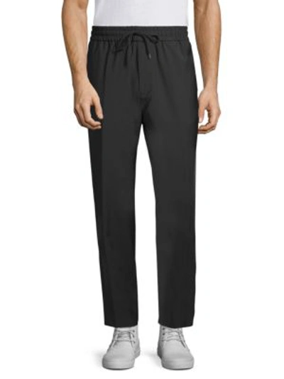 Shop Etudes Studio Jalousie Tapered Trousers In Black