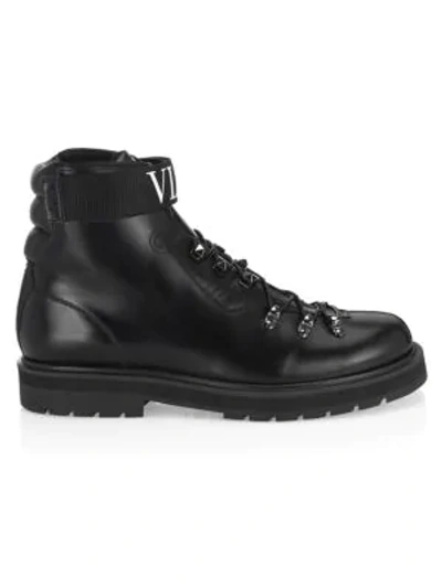 Shop Valentino Logo Leather Combat Boots In Black