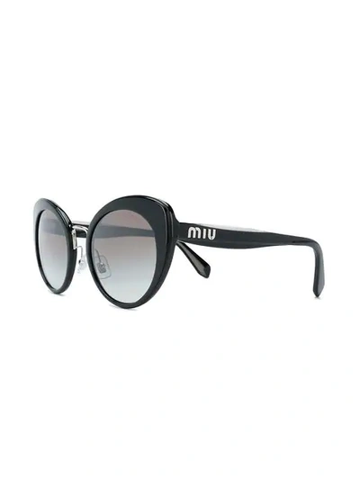 Shop Miu Miu Eyewear Cat-eye Frame Sunglasses - Black