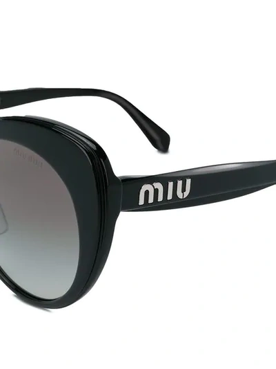 Shop Miu Miu Eyewear Cat-eye Frame Sunglasses - Black