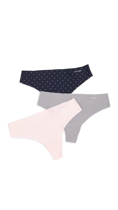 Shop Calvin Klein Underwear Invisibles Thong 3 Pack In Nymph's Thigh/classic Dots/moo