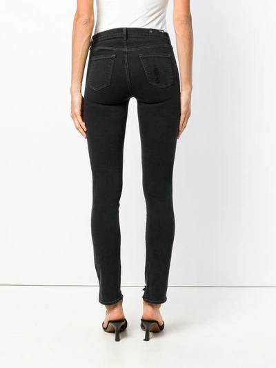 Shop J Brand Ripped Slim Jeans In Black