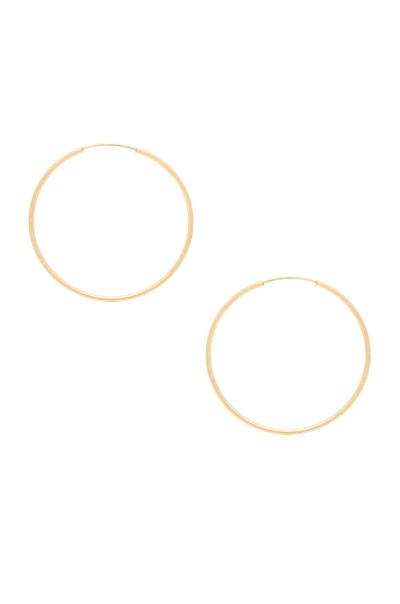 Shop Sachi Infinity Hoops In Yellow Gold