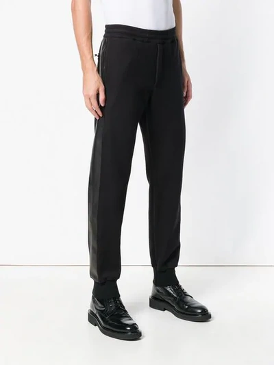 Shop Alexander Mcqueen Tapered Side Stripe Track Pants - Black