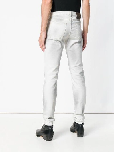 Shop Givenchy Dusted Slim-fit Jeans - White