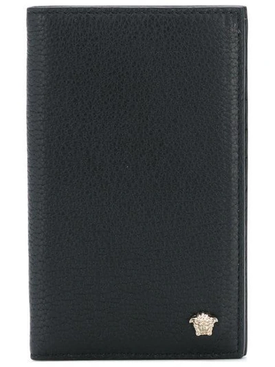 Shop Versace Long Bi-fold Wallet - Black