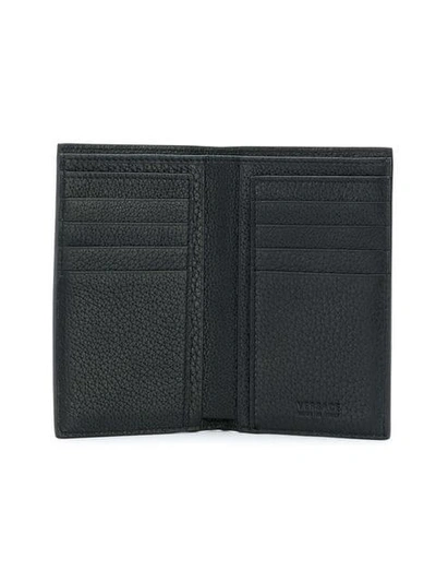 Shop Versace Long Bi-fold Wallet - Black