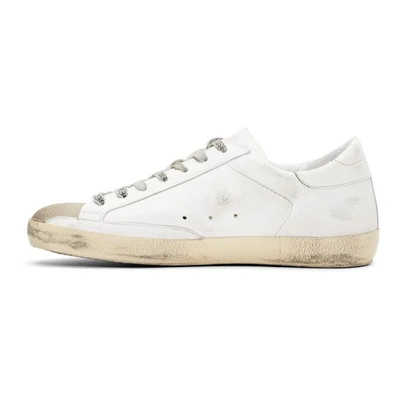 Shop Golden Goose White Flag Superstar Sneakers