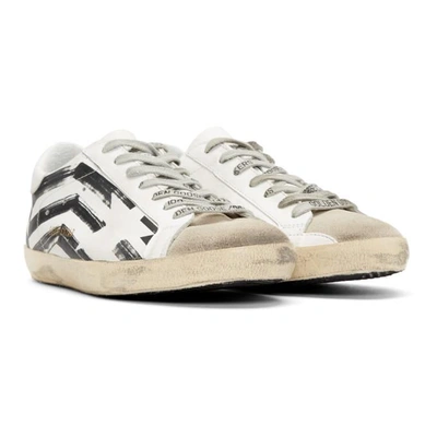 Shop Golden Goose White Flag Superstar Sneakers