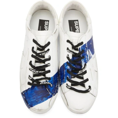 Shop Golden Goose White And Blue Stripe Superstar Sneakers In White-blue