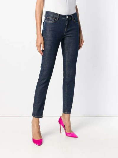 Shop Dolce & Gabbana Rear-slogan Skinny-fit Jeans In Blue