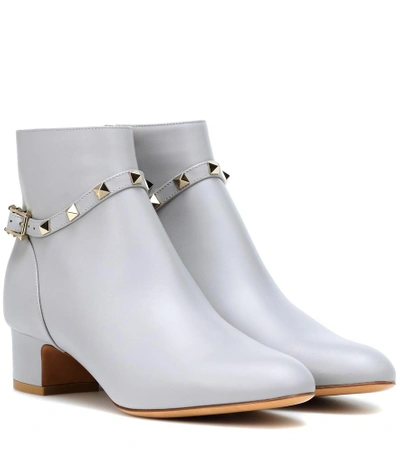 Shop Valentino Rockstud Leather Ankle Boots In Grey