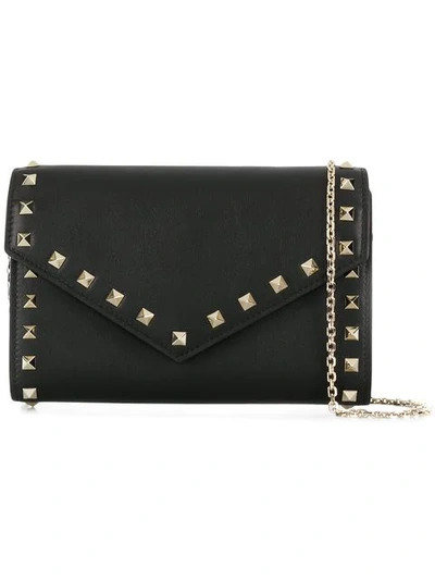 Shop Valentino Rockstud Envelope Crossbody Bag In Black