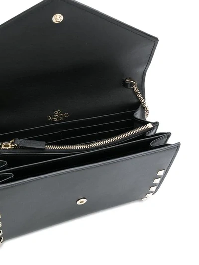 Shop Valentino Rockstud Envelope Crossbody Bag In Black