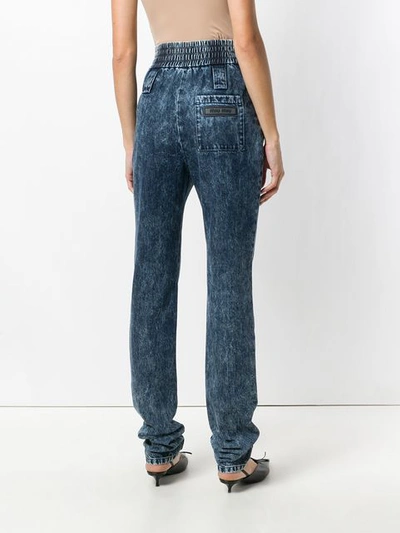 Shop Miu Miu Elasticated Tapered Jeans In Blue