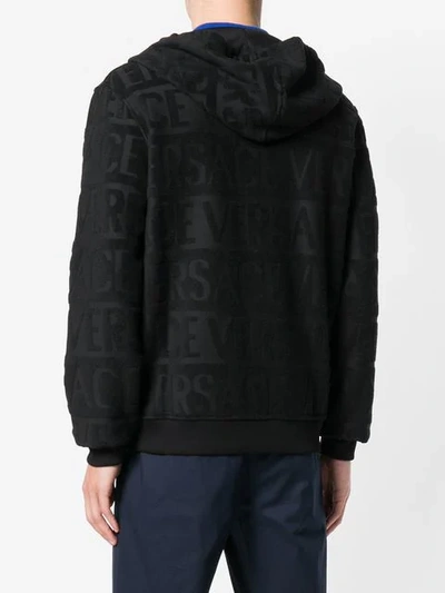 Shop Versace All Over Logo Hoodie In Black