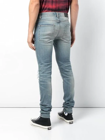 Shop Amiri Distressed Slim-fit Jeans - Blue