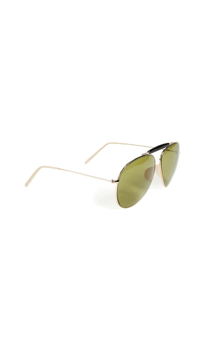 Shop Acne Studios Howard Sunglasses In Gold/black