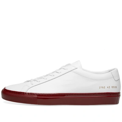 Shop Common Projects Achilles Low Coloured Shiny Sole In Red
