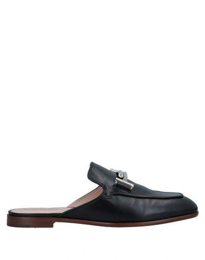 Shop Tod's Mules In Black