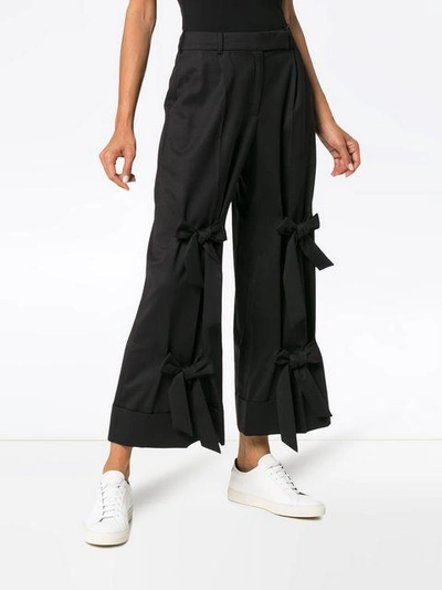 Shop Simone Rocha Bow Embellished Wool Blend Wide Leg Trousers - Black
