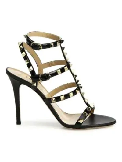 Shop Valentino Rockstud Patent Leather Cage Sandals In Black