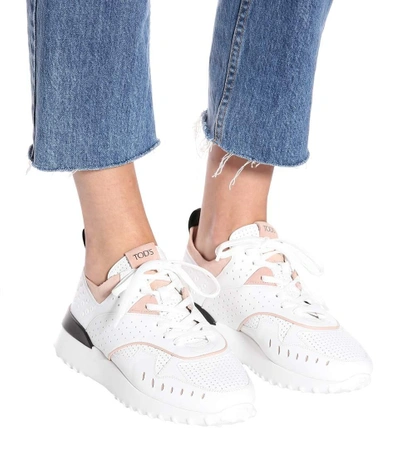 Shop Tod's Leather Sneakers In White