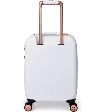 Shop Ted Baker Small Beau 21-inch Bow Embossed Four-wheel Trolley Suitcase - White