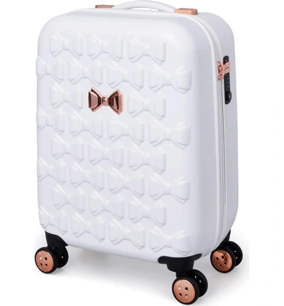 Shop Ted Baker Small Beau 21-inch Bow Embossed Four-wheel Trolley Suitcase - White