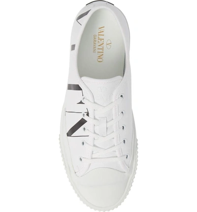 Shop Valentino Vltn Low Top Sneaker In White/ Black