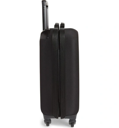 Shop Eastpak Tranzshell Small 22-inch Wheeled Suitcase - Black