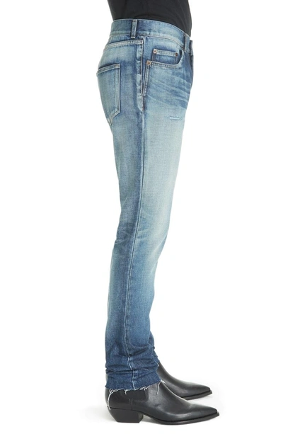 Shop Saint Laurent Cutoff Skinny Jeans In 4351 Blue