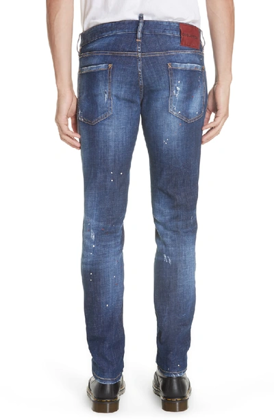 Shop Dsquared2 Paint Splatter Slim Fit Jeans In Blue