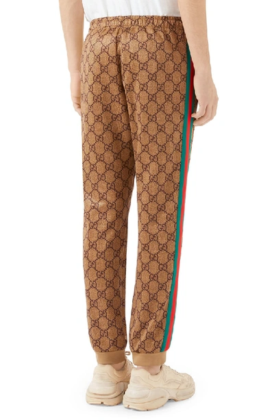 Shop Gucci Print Tech Jersey Jogger Pants In Beige