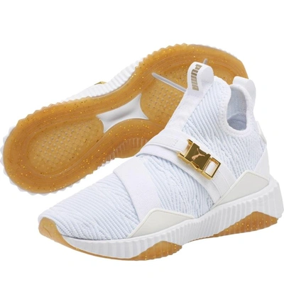 Shop Puma Defy Mid Varsity Sneaker In  White/ Metallic Gold